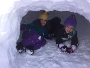 Megan and friend in the igloo
